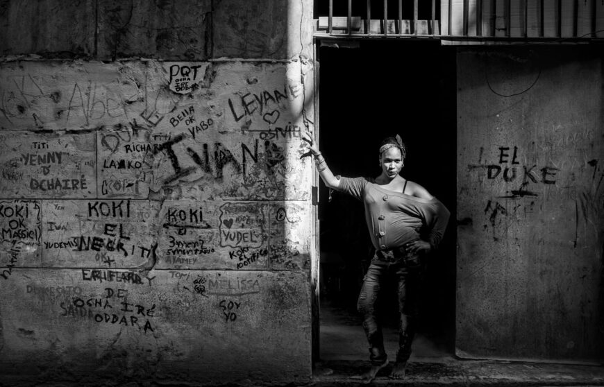 a girl in front of a door in Havana