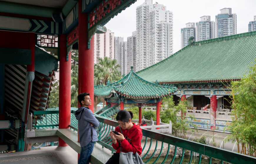 a scene of hong kong with skyscrapers on the background